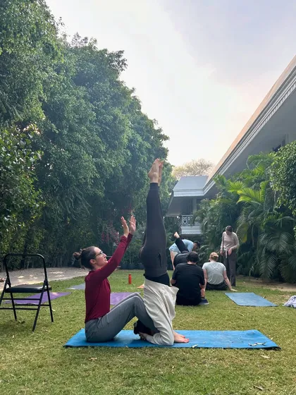 This was a dream manifested: teaching yoga to a group of seekers from the USA. Here, I am assisting a student in a supported headstand, a moment that felt both thrilling and terrifying.