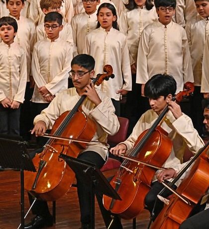 A close-up of our young string players performing with the choir. We encourage cross-program collaboration to create rich and varied musical textures.