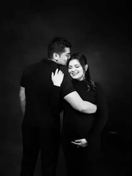 Timeless, elegant, and full of love. This black and white couple's maternity portrait captures a quiet, intimate moment between the parents-to-be.