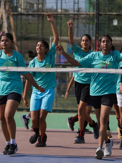 Arms up and ready. Our girls team is full of energy as they go through their warm-up routine, getting mentally and physically prepared for the Shanghai tour.