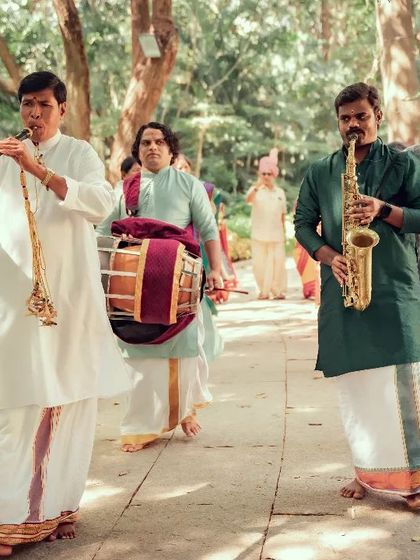 Capturing the sounds of tradition, this photo shows musicians playing the nadaswaram and thavil during a South Indian wedding procession.