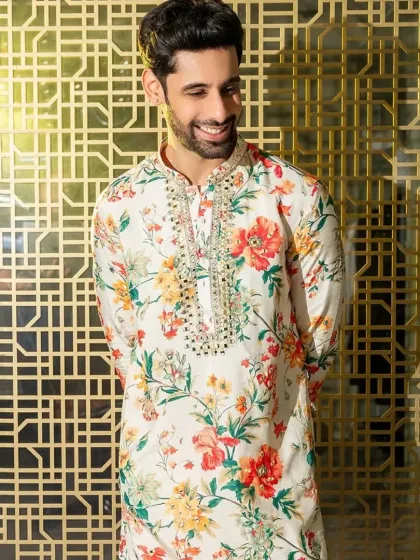A beautiful floral print kurta with a mirror-work embroidered neckline. A perfect blend of print and craft for a summer event.