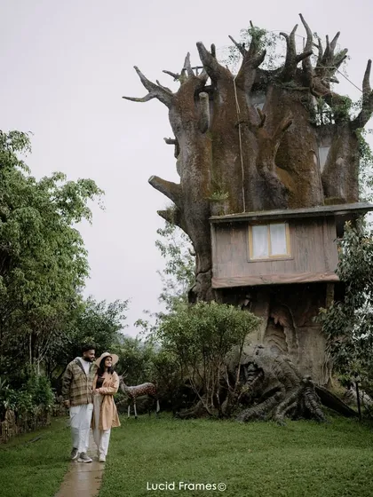 A fairytale moment in front of a whimsical treehouse in Wayanad. We help you find unique locations for your pre-wedding shoot that reflect your personality as a couple.