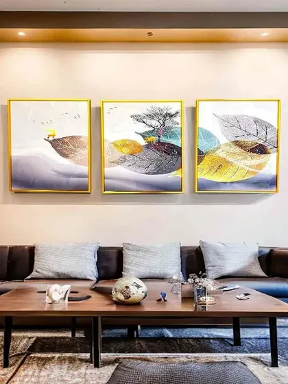 A triptych of crystal paintings that explores the beauty of leaves in abstract form. This set of three 16x24 inch frames creates a sophisticated and naturalistic gallery wall, perfect for a modern living room.