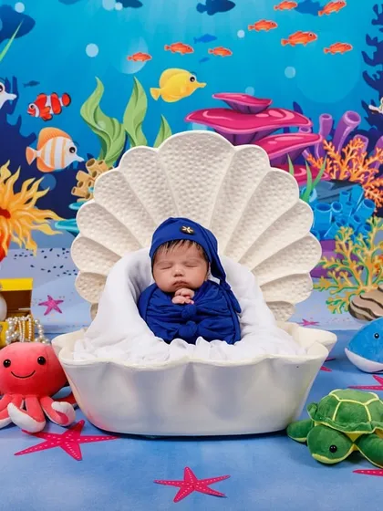 Under the sea! This little one is dreaming peacefully as a tiny pearl in a shell, surrounded by colorful coral and friendly sea creatures.