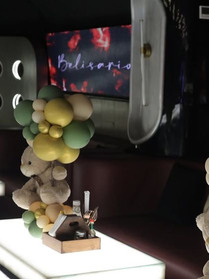 Teddy bear centerpieces arranged on illuminated tables in a lounge setting. This shows how I can adapt a theme to fit different venue styles, from bright cafes to darker, chic lounges.