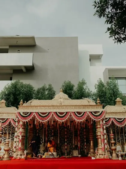 The grandeur of a temple mandap set against a modern home. This shot shows how we use our architectural eye to place magnificent traditional structures in any setting, creating a stunning contrast.