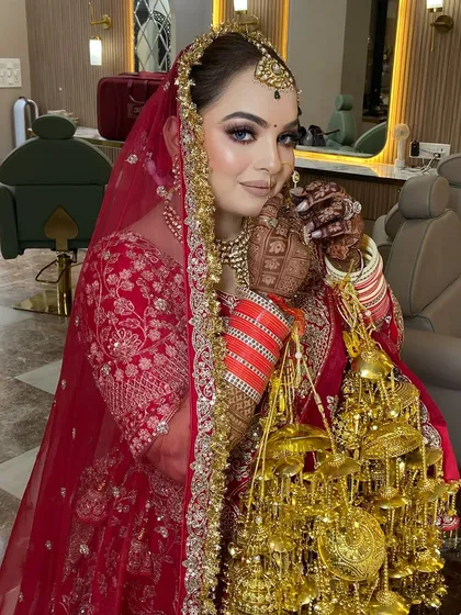 A classic red bridal lehenga deserves a timeless makeup look. For this bride, I focused on a flawless base, defined eyes, and a confident pose, ensuring she felt as incredible as she looked on her big day.
