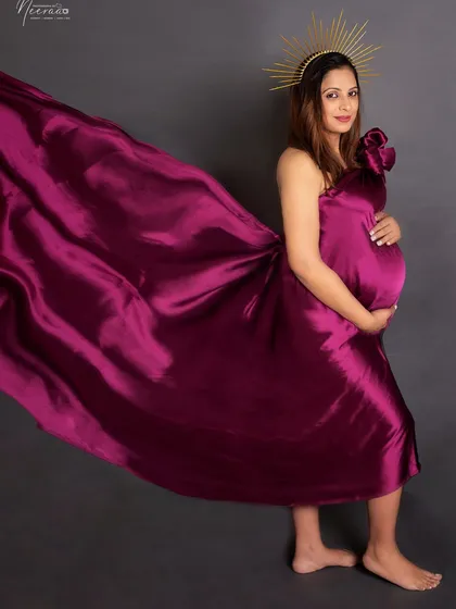 The magic of movement. By tossing the satin fabric, we create this dynamic, flowing effect that adds a touch of drama and elegance to the portrait.