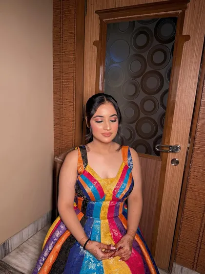 A fun and vibrant look for a party! The colorful dress is balanced with a soft glam makeup look, featuring a subtle smokey eye and a nude lip to keep the focus on the outfit.