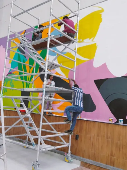 There's a special kind of chaos I live for, and it looks a lot like this. High up on the scaffolding with my incredible team, bringing a massive, vibrant mural to life for a corporate client. We transform office spaces into places of energy and inspiration.