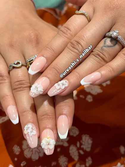 You can never go wrong with a classic, and this is my modern take on it. A timeless French manicure elevated with delicate, hand-sculpted 3D flowers, perfect for a bride or anyone who loves a touch of soft, floral elegance.