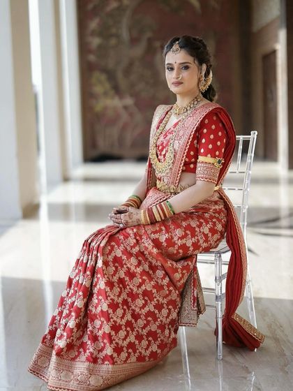 A full length shot of the bride in her Sabyasachi saree. The entire look is one of regal elegance, from the perfect drape to the flawless makeup.