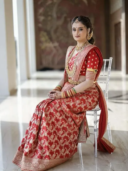 A full length shot of the bride in her Sabyasachi saree. The entire look is one of regal elegance, from the perfect drape to the flawless makeup.