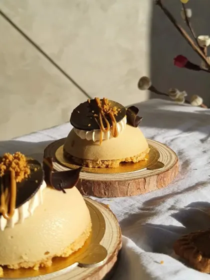 Golden hour hitting these mini Biscoff cheesecakes just right. The sunlight really brings out the beautiful textures and layers of this dessert.