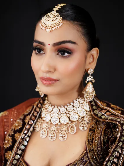 This elegant bridal portrait demonstrates a soft cut-crease eye makeup technique with a warm, neutral palette. My courses cover both classic and trending eye makeup styles for brides.