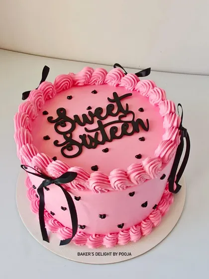 Another view of the chic Sweet Sixteen cake, showing the contrast between the soft pink frosting and the bold black details.