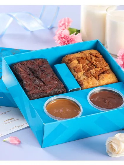 The 'Laadli Rakhi Hamper' comes with two types of brownies and two delicious dips. It's a perfect treat to share with your sibling.