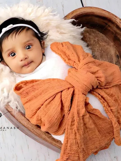 A beautiful, expressive portrait of an awake baby in our popular heart bowl prop.