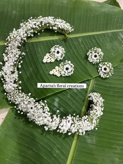 A delicate floral tiara and matching earrings made from baby's breath. This is perfect for a baby shower, a bridesmaid, or even a flower girl.