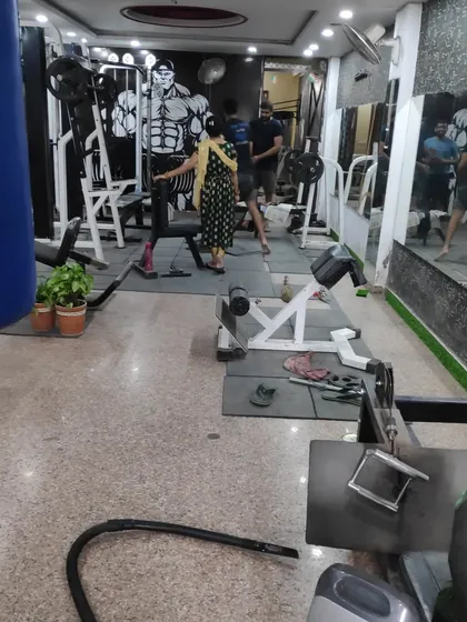 A typical day at the gym. Members using the equipment for their strength training workouts as part of their overall fitness plan.