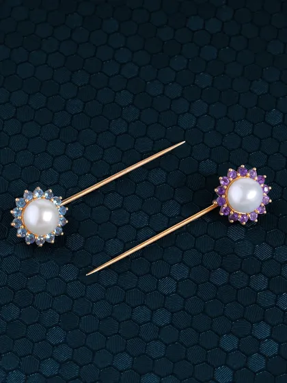 Pin your dreams. My classic pearl pins, studded with colourful gemstones like aquamarine and amethyst, are waiting to adorn your story. A perfect way to add a touch of elegance to any outfit.