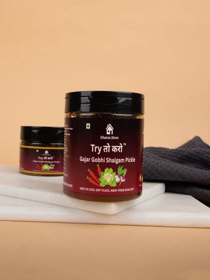 Jars of Gajar Gobhi Shalgam Pickle on a marble slab, creating a clean and modern look for a traditional product.