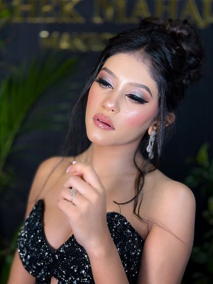 A close-up of the silver cut-crease eye makeup. The sharp lines and glitter make the eyes pop, creating a truly glamorous look.