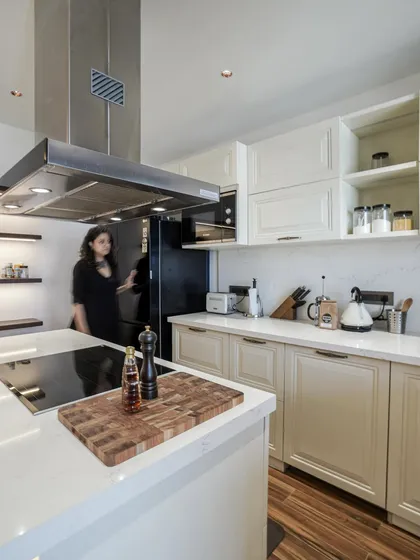 A candid shot of me in the kitchen from image 5, highlighting the spacious and practical design.