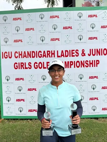 Riya Jadon with her two trophies after a commendable performance at the IGU Chandigarh Ladies & Junior Girls Golf Championship.