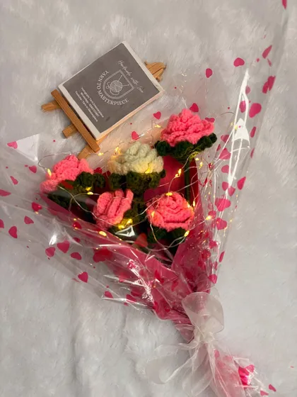 My LED light rose bouquet shown with my brand card. The lights add a magical touch, making it a perfect gift for anniversaries, birthdays, or romantic occasions.