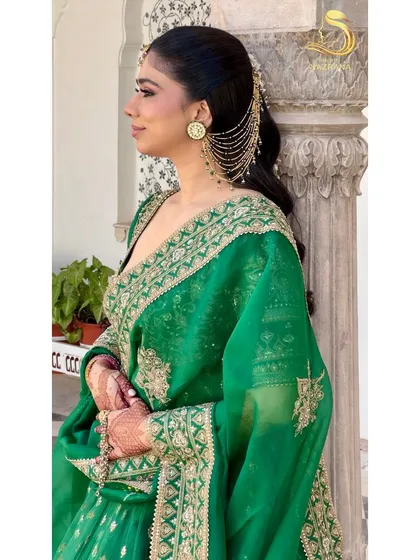 A side profile showing how the kaan chains are elegantly integrated with the hairstyle.