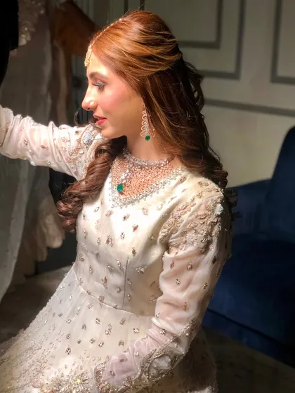 A candid shot of the Nikaah bride, her romantic hairstyle looking perfect from every angle.