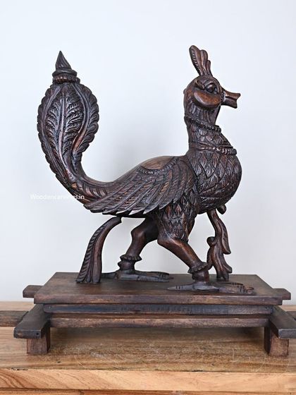 A 22-inch standing Hamsa (Annapakshi) bird on a base, finished in a dark brown wax. This piece is lightweight and perfect as a tabletop sculpture.