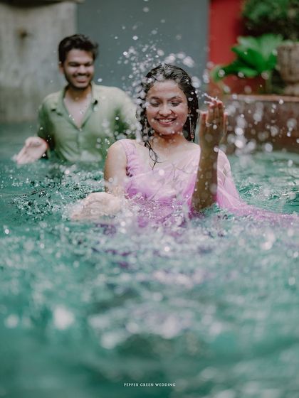 Simran and Pranjal's playful splash in the pool. These fun, energetic shots are a great way to show a couple's joyful side.
