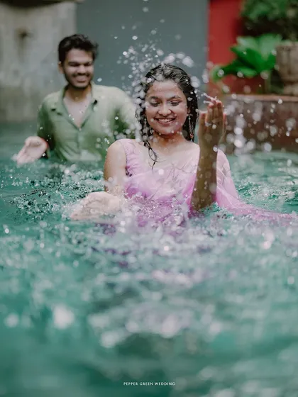 A playful splash in the pool. I encourage couples to have fun and be themselves, which results in genuine and memorable pre-wedding photos.