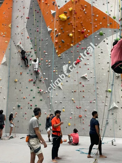 Another view of our spacious gym, with climbers spread out across different walls and routes.