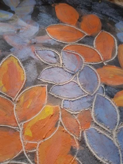 A close up look at the texture created by the sgraffito technique. You can see how the carved lines give the leaves definition and depth. It is these small, handmade details that make each piece special.