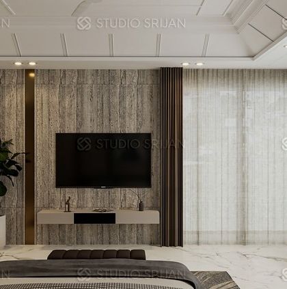 A bedroom in Model Town with a sophisticated, textured wallpaper on the accent wall, framed by elegant bronze-colored metal strips.