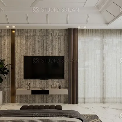 A bedroom in Model Town with a sophisticated, textured wallpaper on the accent wall, framed by elegant bronze-colored metal strips.