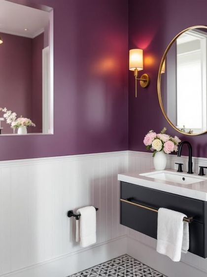 A third take on the purple powder room, this time with white wainscoting that provides a crisp contrast to the bold wall color, making the space feel bright yet elegant.
