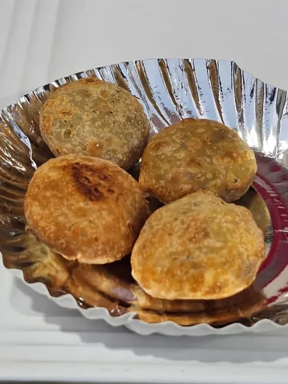 Hot and fresh kachoris, a classic savory snack. The flaky pastry and spiced filling make it an irresistible part of my Gujarati and Marwari catering menus.