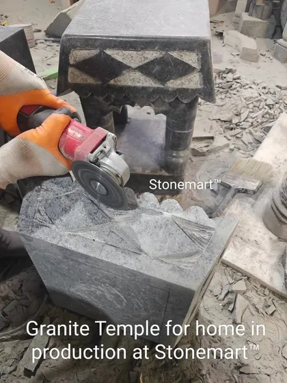 Here you can see one of our skilled murtikars giving the final touches to a granite temple for a home. This image captures the intricate, hands-on process and the dedication that goes into every detail of our hand-carved stone temples.