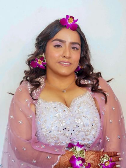 A beautiful, smiling portrait of the bride on her Haldi day. The makeup is radiant and flawless, designed to withstand the fun and festivities of the ceremony.