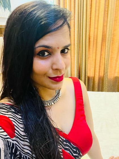 A bold and playful custom saree look. I paired a vibrant red blouse with a black and white zebra-print saree that has large red heart motifs, perfect for a client who loves to make a statement.