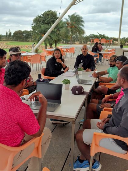 It takes a team to build a champion. Our monthly all-hands meeting where coaches, trainers, and support staff align on each athlete's progress, goals, and challenges.