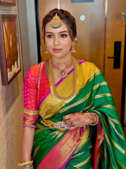 A poised portrait that captures the regal essence of the South Indian bridal aesthetic.