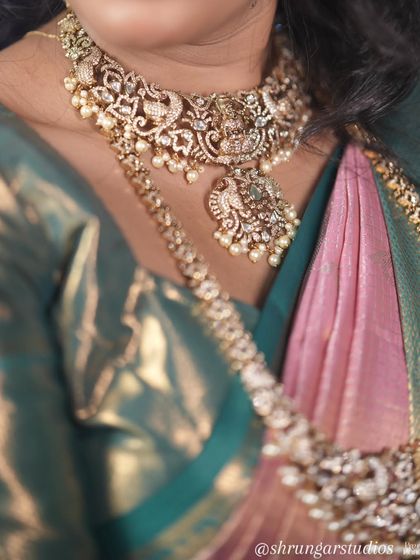 Unique caption for media id 136 describing the specific jewellery and look.