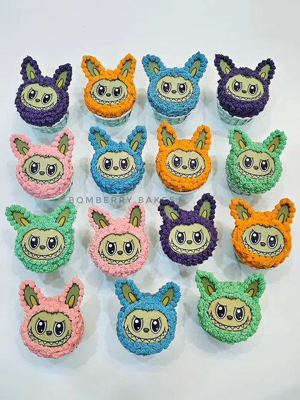 A colorful array of Labubu monster cupcakes, perfect for a trendy kids' birthday party. Each one has a unique color and a fun, furry buttercream texture.