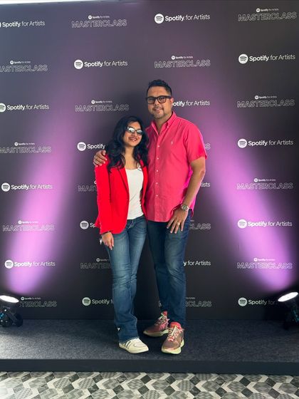 Posing with my mentor at the Spotify Masterclass event. This photo shows the support system behind my career and our presence at important industry gatherings.